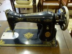 Singer Electric Sewing Machine, with cabinet, side flap missing, the cabinet having a drawer in