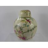 A Ginger Jar, decorated with flowers, butterflies and birds, approx 21 cms high, with lid.