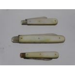 Three Mother of Pearl and Silver Fruit Knives. (3).