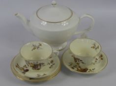 A Part Royal Worcester Tea Set, comprising eleven tea cups, eleven saucers, sugar bowl, twelve