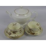A Part Royal Worcester Tea Set, comprising eleven tea cups, eleven saucers, sugar bowl, twelve