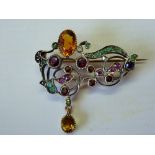 An Antique Silver and Gold, Ruby, Emerald, Garnet and Amethyst Brooch.