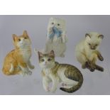 Four Royal Worcester Feline Figurines, including Siamese, Ginger, Tabby and a Persian. (4)