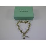 A Tiffany & Co., Solid Silver Bracelet with Heart Shape and Charms, approx 28 gms.