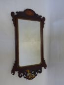 A Mahogany Framed Wall Mirror, bevelled glass with decorative shell motif to the outer frame, topped