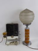 An Art Deco Lamp Base, with a glass globular shade together with a chrome and glass shaving