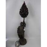 A Spelter Figural Lamp Base, with ruby coloured flame shade held aloft, approx 84 cms