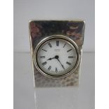A Circa 1920's Asprey of London Silver Cased Travelling Clock, the clock having a hammered finish
