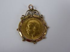 George V Solid Gold Half Sovereign, mounted in rose gold, dated 1915.