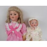 German Bisque Headed Dolls, hand painted face, open mouth revealing small teeth, composite body with