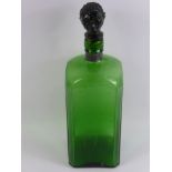 A Bristol Green Decanter, with a stopper in the form of a head, approx 36 cms.