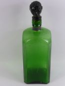 A Bristol Green Decanter, with a stopper in the form of a head, approx 36 cms.