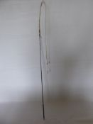 A Victorian Lunging/Schooling Whip, with black leather handle.