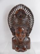 A Hand Carved Feminine Bust, in the Indonesian style, approx 40 cms.