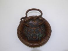 An Antique Copper Dish, embossed with a mandarin figure to the base.