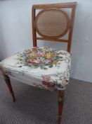 A Sheraton-Style Bedroom Chair, hand painted with swags, circular cane back support on splayed