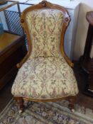 An Edwardian Bedroom Chair, fruit wood frame supported on turned legs with porcelain casters, floral