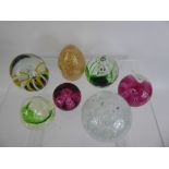 A Quantity of Glass Paperweights, including Caithness 'Congratulations' amongst others.