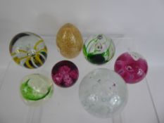 A Quantity of Glass Paperweights, including Caithness 'Congratulations' amongst others.