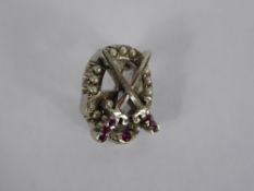 A White Metal "Theta Chi" Fraternity Brooch, designed with a pair of crossed swords over a viper,