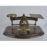 A Set of Vintage Brass Postal Scales, with a small quantity of weights.