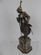 An Antique German Silver Cast Figure of Medieval Knight, standing at arms, having a carved ivory