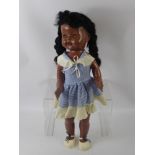 A Vintage Walking Doll, sleeping eyes and articulated limbs, smiling mouth revealing top teeth,