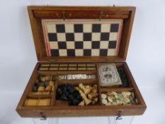 A Vintage Boxed Compendium of Games, including chess, dominoes, draughts and steeple chase etc.