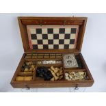 A Vintage Boxed Compendium of Games, including chess, dominoes, draughts and steeple chase etc.