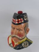 A Royal Doulton 25 Year Old Grant's Scotch Whisky Character Decanter, together with a Moorcroft