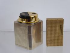 A Vintage Silver Cased Desk Lighter, together with a gold plated Dupont lighter.