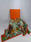 A Lady's Square Silk Hermes Scarf, 'Kachina' design signed Olivier Kermit, in the original box. (box