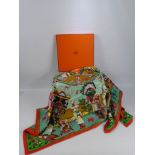 A Lady's Square Silk Hermes Scarf, 'Kachina' design signed Olivier Kermit, in the original box. (box