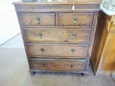 A Vintage Oak Chest of Drawers, with two short and three long drawers, raised on turned ball feet,