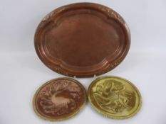 Two Circular Copper and Brass Dishes, signed T.E. Lewis dated 1939, together with an oval hammered