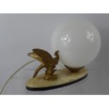 An Art Deco Brass Lamp, depicting an exotic bird on marble base.