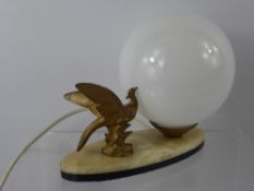 An Art Deco Brass Lamp, depicting an exotic bird on marble base.