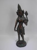 A Bronzed Sino-Tibetan Feminine Figure, hand raised in blessing, approx 41 cms