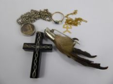 A Lady's Black Stone Cross Pendant, together with an amethyst style claw brooch,