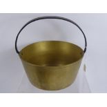 A Brass Jam Pan, with cast iron handle, approx 26 x 13 cms together with two copper plungers. (3)