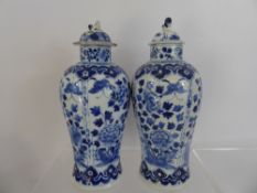 Pair of Chinese Blue and White Vases and Covers, hand painted with chrysanthemum and butterflies,