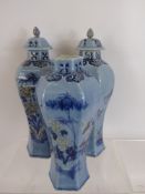 Three Oriental Ceramic Blue Glazed Baluster Vases and Covers, hand painted with floral spray, approx