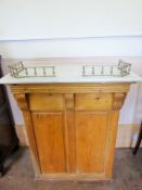 An Antique Pine and Marble Topped Shop Counter, single drawer with two shelves, brass gallery to