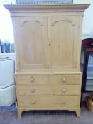 An Antique Pine Linen Chest, the top converted to cupboard space, two short and two long drawers