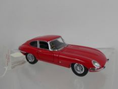 A 1961 Franklin Mint Die Cast Red Jaguar E-type Coupe Miniature Car.