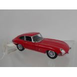 A 1961 Franklin Mint Die Cast Red Jaguar E-type Coupe Miniature Car.