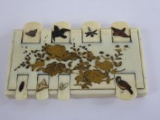 A 19th Century Japanese Shibayama Gilded Ivory Inlaid Game Counter. The counter depicting various