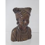 An African Carved Bust of a Lady, with glass eyes, approx 15 cms h.