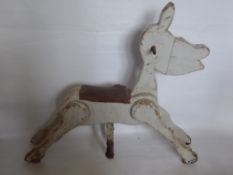 An Antique Wooden Fairground Horse, with leather seat held together with studs, cast iron hand