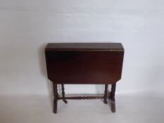 A Small Mahogany Drop-Leaf Table, approx 60 x 60 x 76 cms, on turned legs.